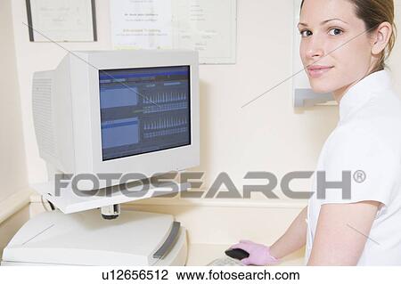 Dental assistant using computer smiling View Large Photo Image Stock Image - Dental assistant using computer smiling. Fotosearch