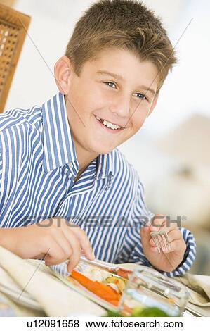 Boy At Christmas Dinner View Large Photo Image Stock Photo - Boy At Christmas Dinner. Fotosearch