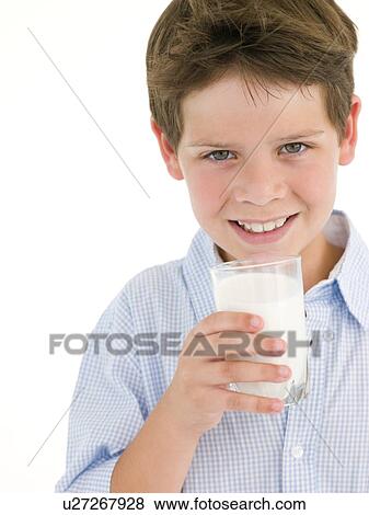 Stock Photo - Young boy with glass of milk smiling. Fotosearch