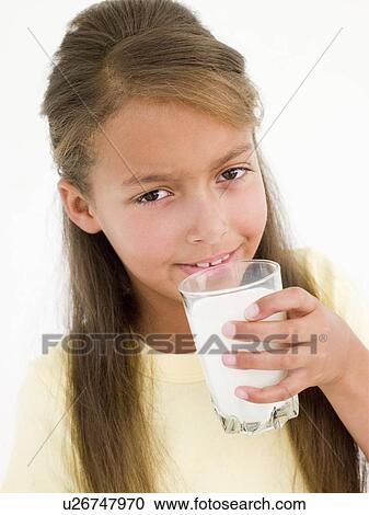 Young girl drinking glass of milk View Large Photo Image Stock Image - Young girl drinking glass of milk. Fotosearch
