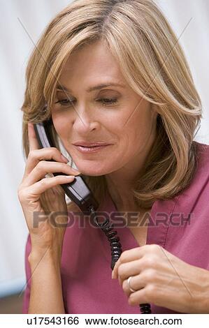 Consultant phoning client with good news View Large Photo Image Stock Photograph - Consultant phoning client with good news. Fotosearch