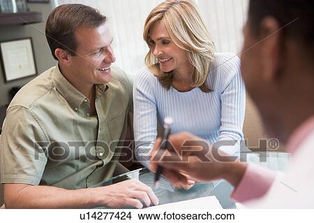 Picture - Couple in consultation at IVF clinic (selective focus). Fotosearch