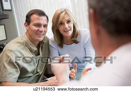 Stock Image - Couple in consultation at IVF clinic (selective focus). Fotosearch