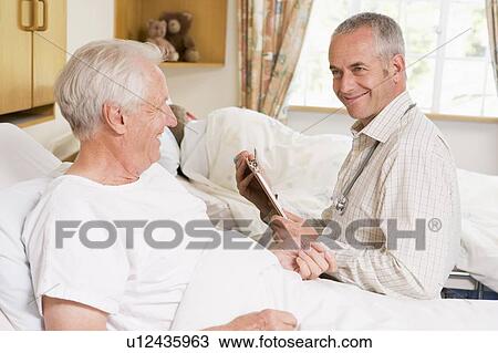 Doctor Checking Up On Senior Man View Large Photo Image Stock Image - Doctor Checking Up On Senior Man. Fotosearch