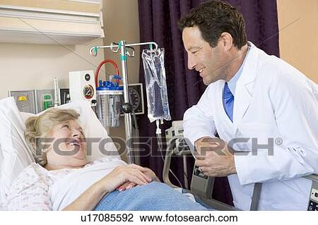 Stock Image - Doctor Talking To Patient. Fotosearch