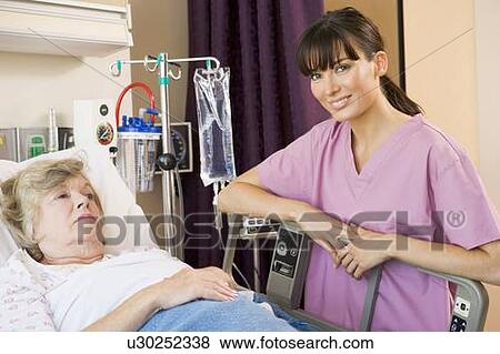 Stock Photo - Nurse Checking Up On Patient. Fotosearch