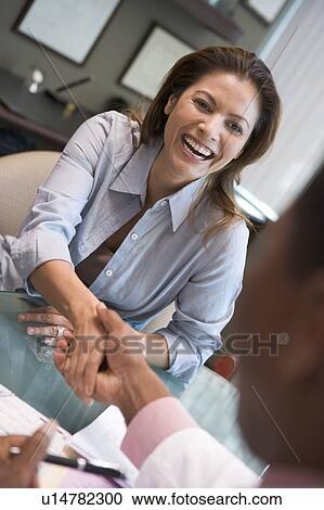 Woman shaking doctor's hand at IVF clinic (selective focus) View Large Photo Image Stock Image - Woman shaking doctor's hand at IVF clinic (selective focus). Fotosearch