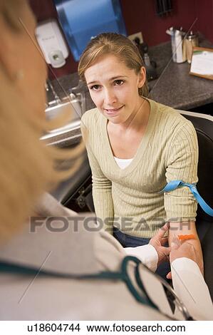 Picture - Young Woman Having Blood Test Done. Fotosearch