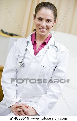 A Doctor Sitting On A Hospital Bed View Large Photo Image Stock Photo - A Doctor Sitting On A Hospital Bed. Fotosearch