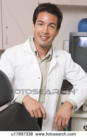 A Doctor Standing By A Computer Monitor View Large Photo Image Stock Photo - A Doctor Standing By A Computer Monitor. Fotosearch