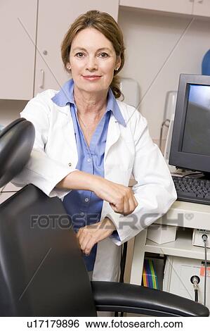 A Doctor Standing By A Computer Monitor View Large Photo Image Stock Photograph - A Doctor Standing By A Computer Monitor. Fotosearch