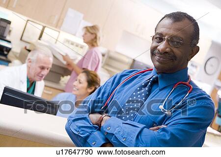 Doctors And Nurses At The Reception Area Of A Hospital View Large Photo Image Stock Image - Doctors And Nurses At The Reception Area Of A Hospital. Fotosearch