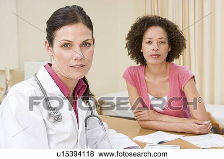 Woman in doctor's office frowning View Large Photo Image Stock Photo - Woman in doctor's office frowning. Fotosearch