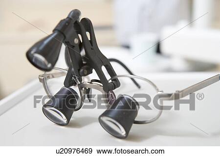 Dentist's eye piece with light View Large Photo Image Stock Photo - Dentist's eye piece with light. Fotosearch