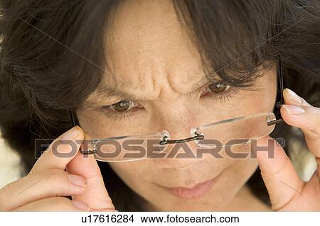 Woman Looking Through New Glasses View Large Photo Image Picture - Woman Looking Through New Glasses. Fotosearch