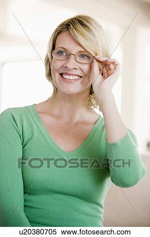 Stock Photography - Woman Looking Through New Glasses. Fotosearch