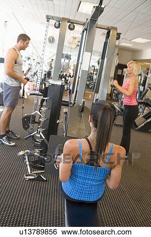 Stock Photograph - Group Of People Weight Training At Gym. Fotosearch