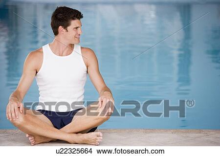 Man sitting poolside smiling View Large Photo Image Picture - Man sitting poolside smiling. Fotosearch