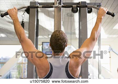 Man Weight Training At Gym View Large Photo Image Stock Image - Man Weight Training At Gym. Fotosearch