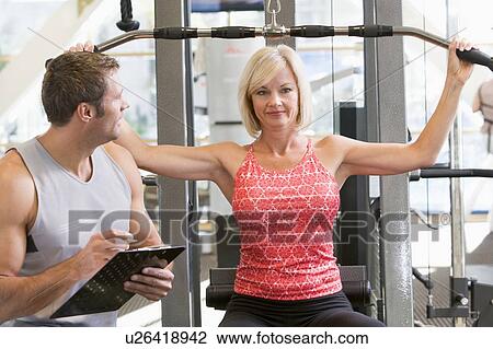 Personal Trainer Watching Woman Weight Train View Large Photo Image Stock Image - Personal Trainer Watching Woman Weight Train. Fotosearch