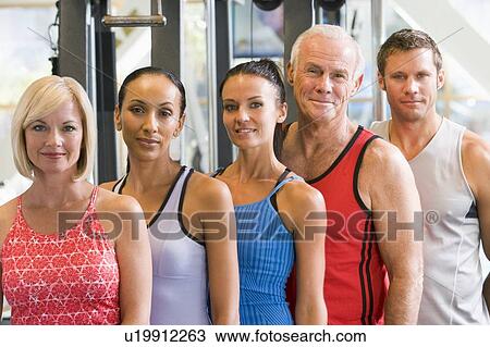 Stock Image - Portrait Of Men And Women At The Gym. Fotosearch