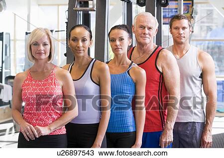 Stock Image - Portrait Of Men And Women At The Gym. Fotosearch