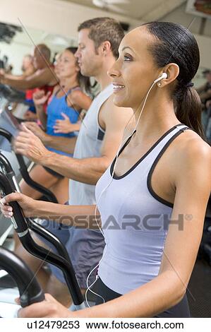 Woman Running On Treadmill At Gym View Large Photo Image Stock Image - Woman Running On Treadmill At Gym. Fotosearch