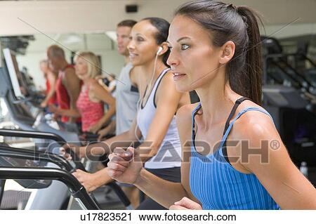 Woman Running On Treadmill At Gym View Large Photo Image Stock Image - Woman Running On Treadmill At Gym. Fotosearch