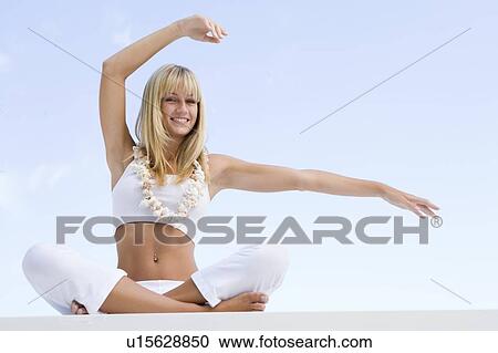Woman sitting and meditating outdoors View Large Photo Image Stock Image - Woman sitting and meditating outdoors. Fotosearch