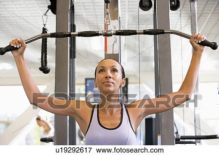 Woman Weight Training At Gym View Large Photo Image Stock Photo - Woman Weight Training At Gym. Fotosearch