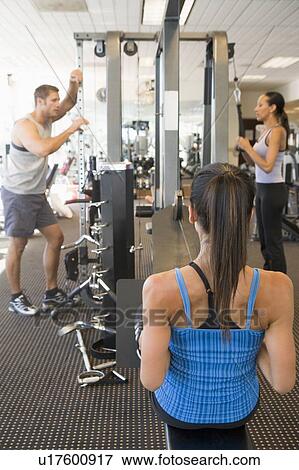 Group Of People Weight Training At Gym View Large Photo Image Stock Photo - Group Of People Weight Training At Gym. Fotosearch