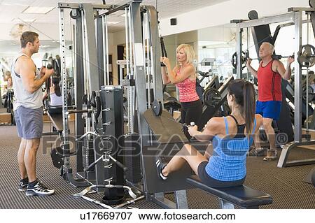 Group Of People Weight Training At Gym View Large Photo Image Stock Photo - Group Of People Weight Training At Gym. Fotosearch