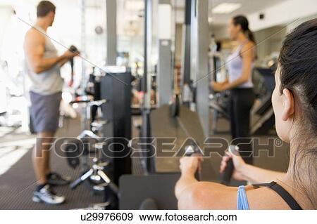 Stock Photo - Group Of People Weight Training At Gym. Fotosearch