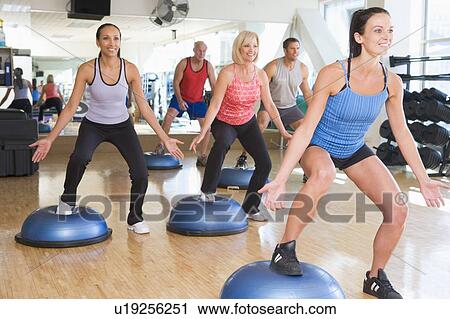 Instructor Taking Exercise Class At Gym View Large Photo Image Stock Image - Instructor Taking Exercise Class At Gym. Fotosearch