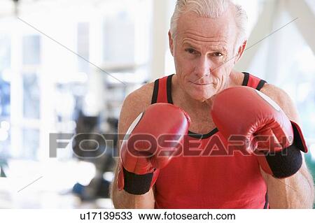 Stock Image - Man Boxing At Gym. Fotosearch
