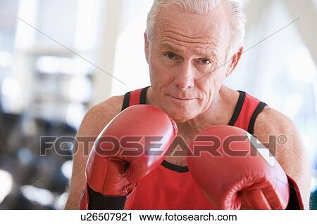Stock Image - Man Boxing At Gym. Fotosearch