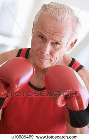 Stock Photo - Man Boxing At Gym. Fotosearch