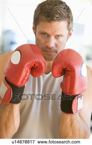 Stock Photo - Man Boxing At Gym. Fotosearch