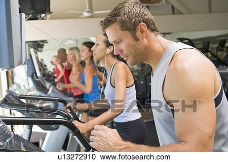 Man Running On Treadmill At Gym View Large Photo Image Stock Image - Man Running On Treadmill At Gym. Fotosearch