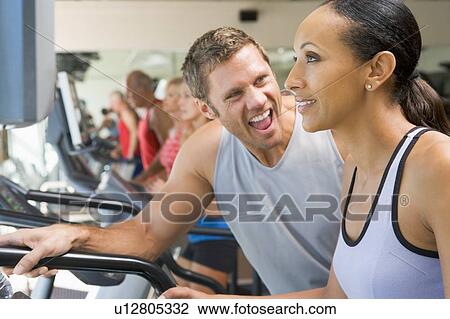 Personal Trainer Encouraging Woman Using Treadmill At Gym View Large Photo Image Stock Image - Personal Trainer Encouraging Woman Using Treadmill At Gym. Fotosearch