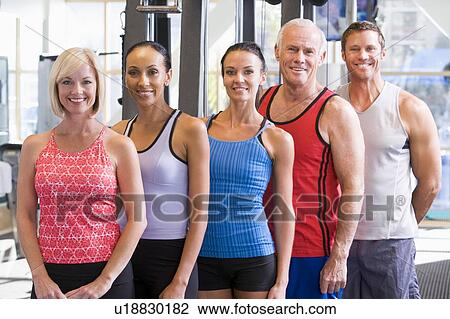 Stock Image - Portrait Of Men And Women At The Gym. Fotosearch