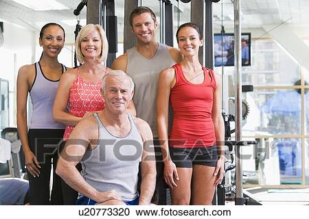 Stock Image - Portrait Of Men And Women At The Gym. Fotosearch