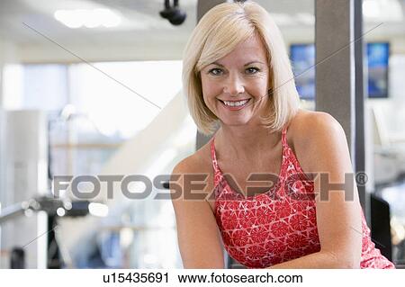Stock Image - Portrait Of Woman At Gym. Fotosearch