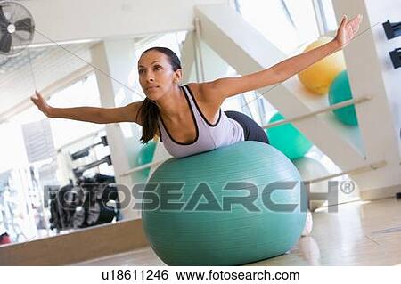 Woman Balancing On Swiss Ball View Large Photo Image Stock Photograph - Woman Balancing On Swiss Ball. Fotosearch