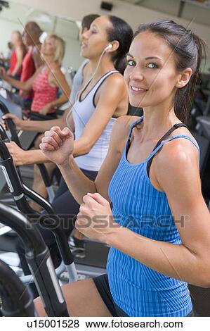 Woman Running On Treadmill At Gym View Large Photo Image Stock Photo - Woman Running On Treadmill At Gym. Fotosearch