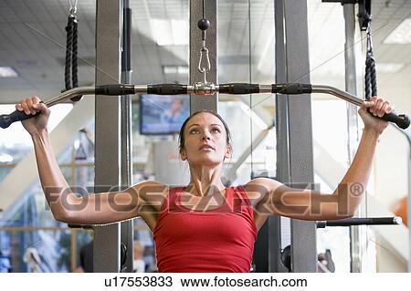 Woman Weight Training At Gym View Large Photo Image Stock Image - Woman Weight Training At Gym. Fotosearch