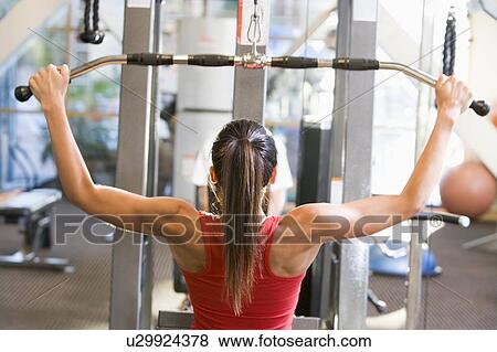 Woman Weight Training At Gym View Large Photo Image Stock Photo - Woman Weight Training At Gym. Fotosearch