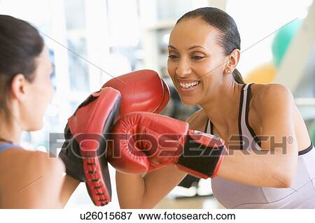 Stock Photo - Women Boxing Together At Gym. Fotosearch