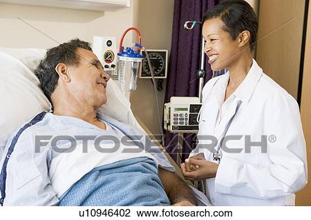 Doctor And Patient Talking To Each Other, Smiling View Large Photo Image Stock Image - Doctor And Patient Talking To Each Other, Smiling. Fotosearch