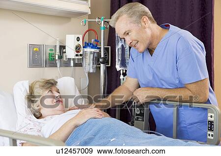 Doctor Checking Up On His Patient View Large Photo Image Stock Photo - Doctor Checking Up On His Patient. Fotosearch